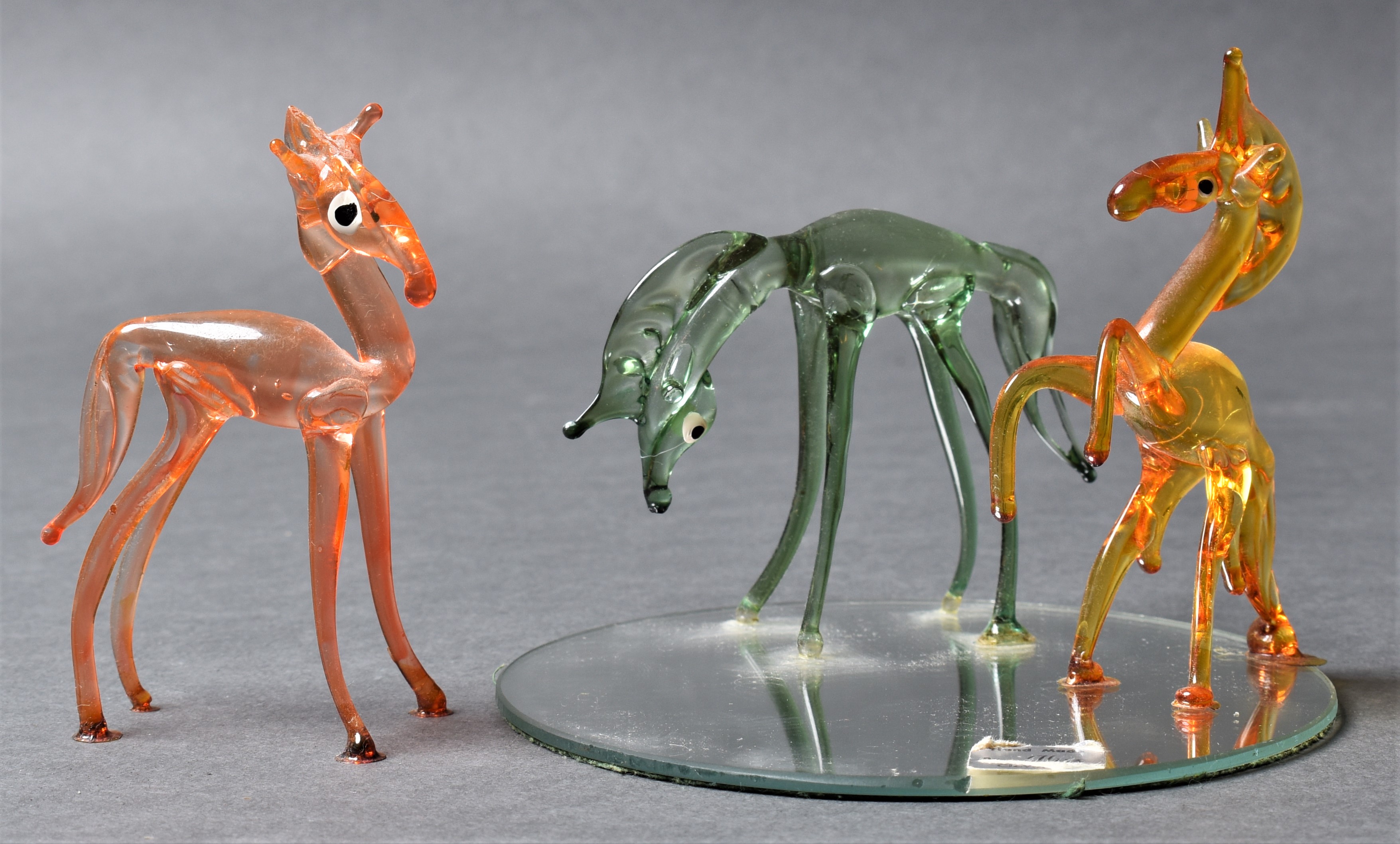 Three glass horse sculptures photographed by Sampson. Links to Product Photography page.